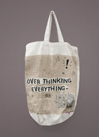 White tote bag with long handles and printed quote 'OVER THINKING EVERYTHING'