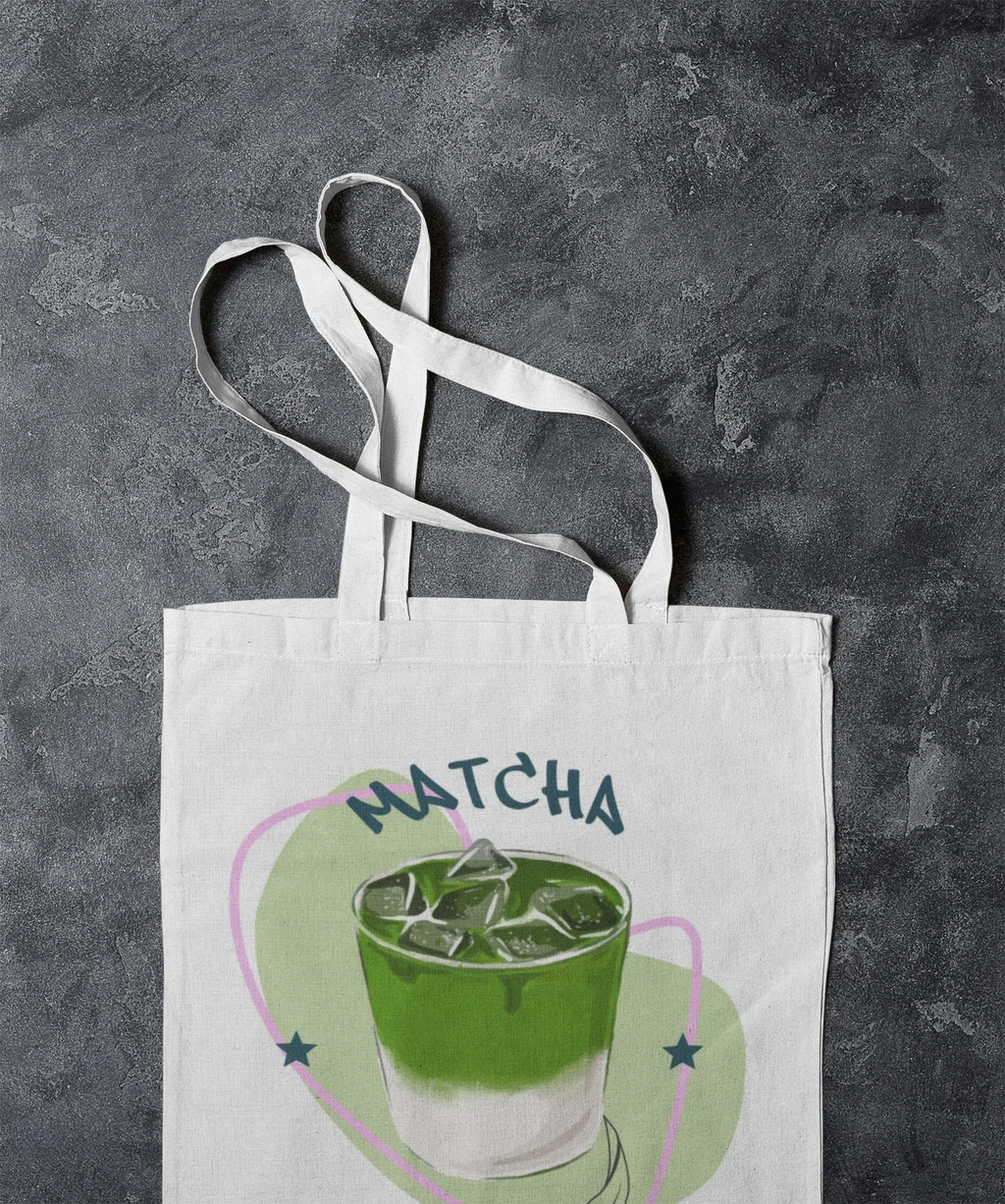White tote bag with “MATCHA” graphic and wide white straps
