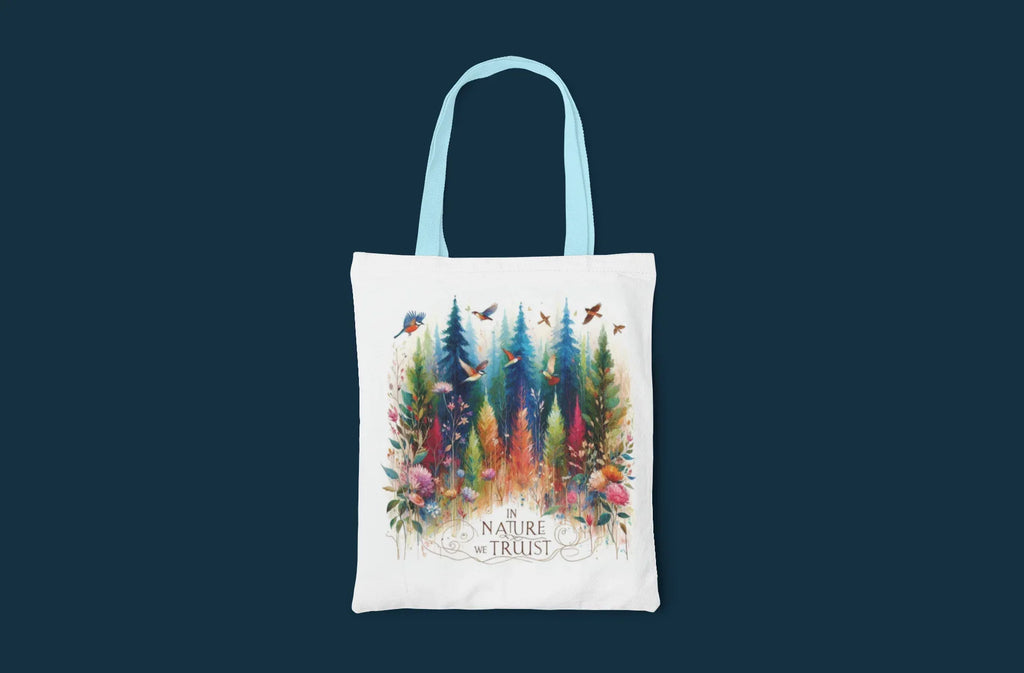 White tote bag with light blue handles, colorful forest and birds print, Nature Trust logo