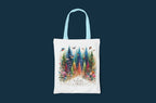 White tote bag with light blue handles, colorful forest and birds print, Nature Trust logo