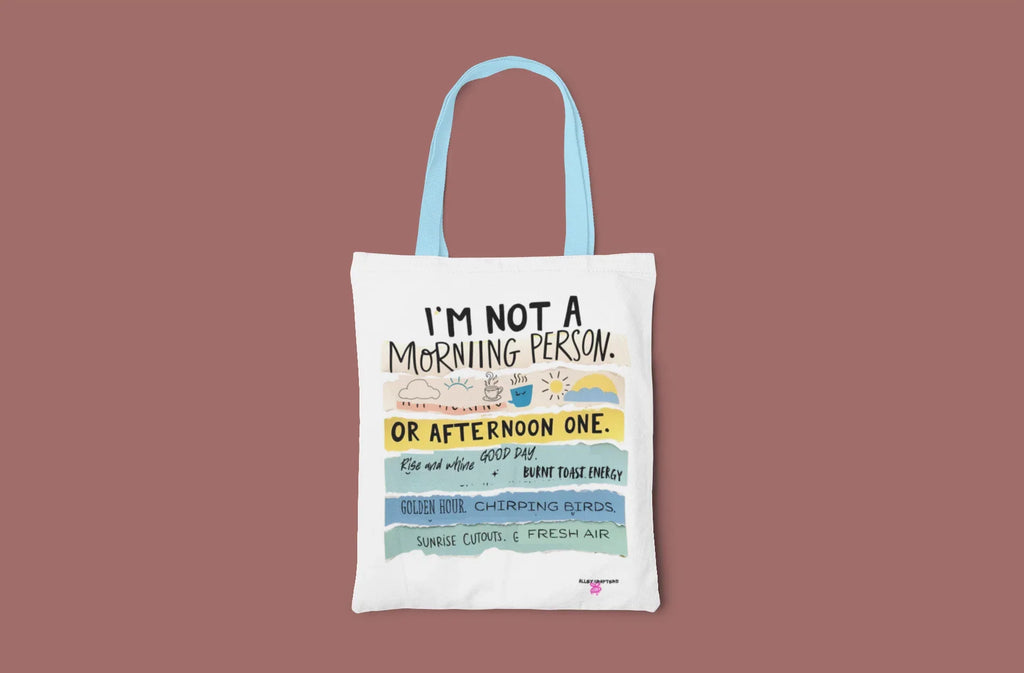 White tote bag with 'I'm not a morning person' and colorful 'or afternoon one' print