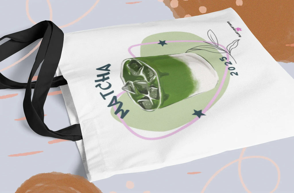 White tote bag with green matcha drink illustration and long black strap