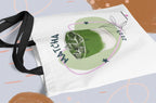 White tote bag with green matcha drink illustration and long black strap