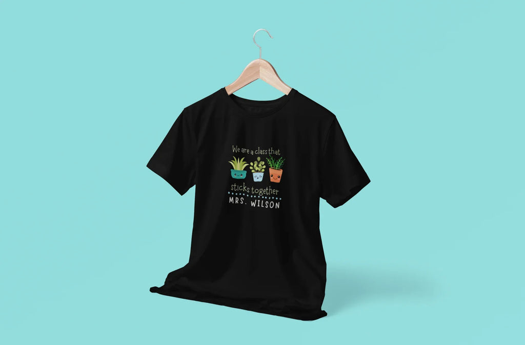 Black teacher t-shirt with centered cartoon plant graphic and front text