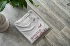 White T-shirt with #PROTECT THE OCEANS print and small bird graphic