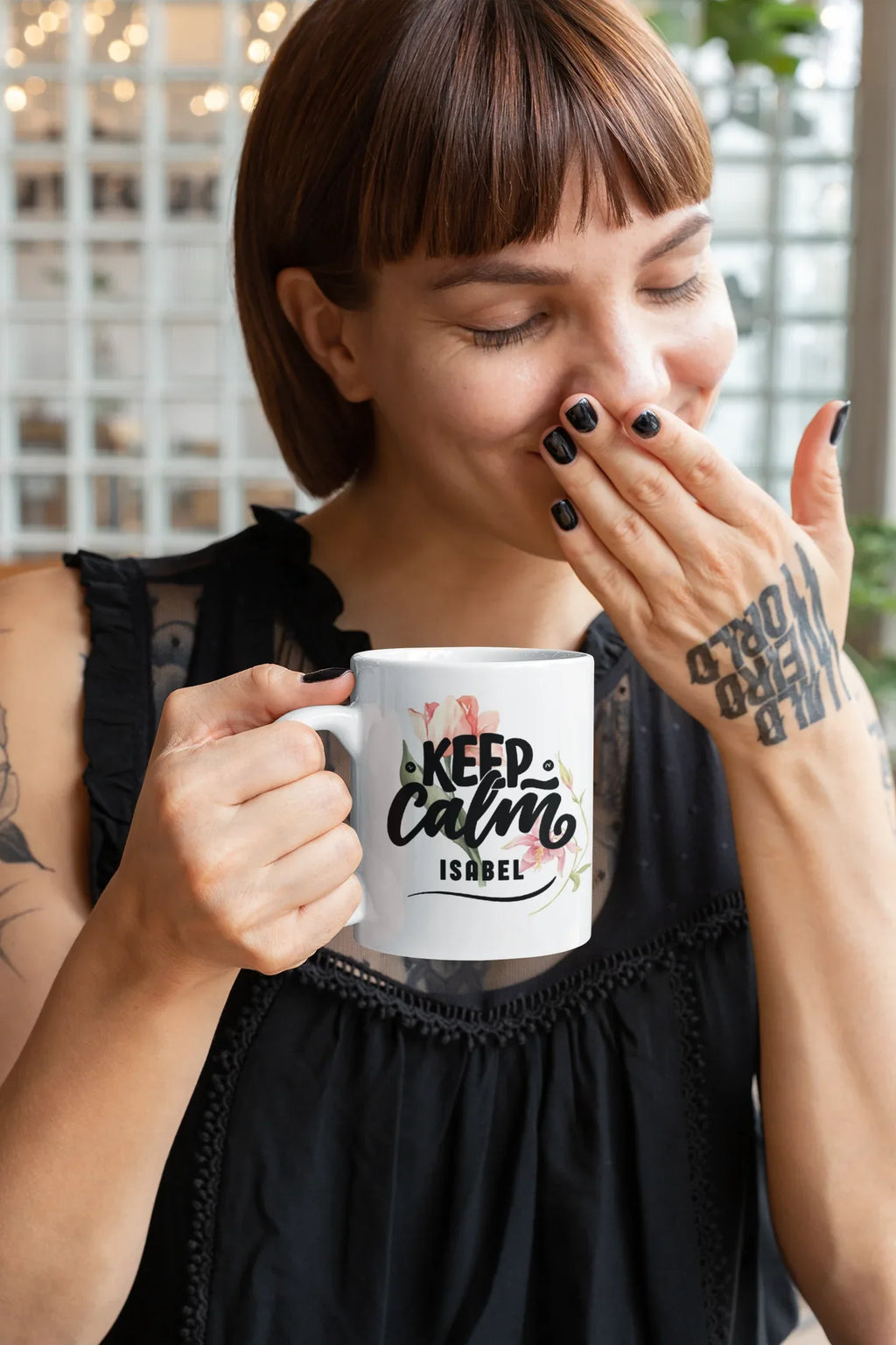 White ceramic mug with Keep Calm floral design and name "ISABEL" on front.