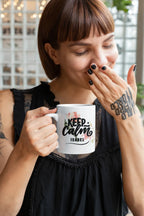White ceramic mug with Keep Calm floral design and name "ISABEL" on front.