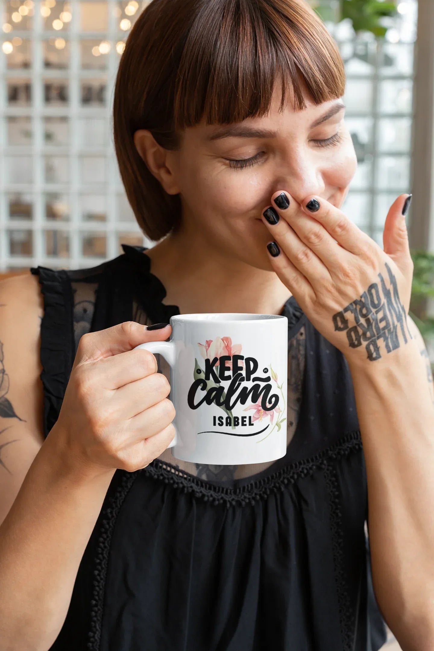 White ceramic mug with Keep Calm floral design and name "ISABEL" on front.