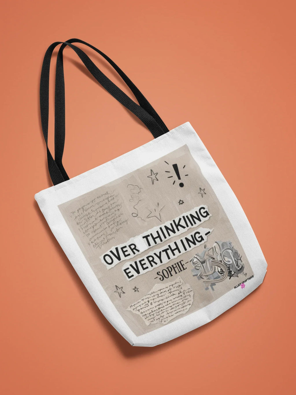 White canvas tote bag with black straps, 'OVER THINKING EVERYTHING' front print