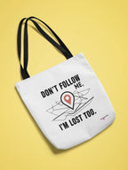 White canvas tote bag with black slogan "DON'T FOLLOW ME" and red location-pin graphic