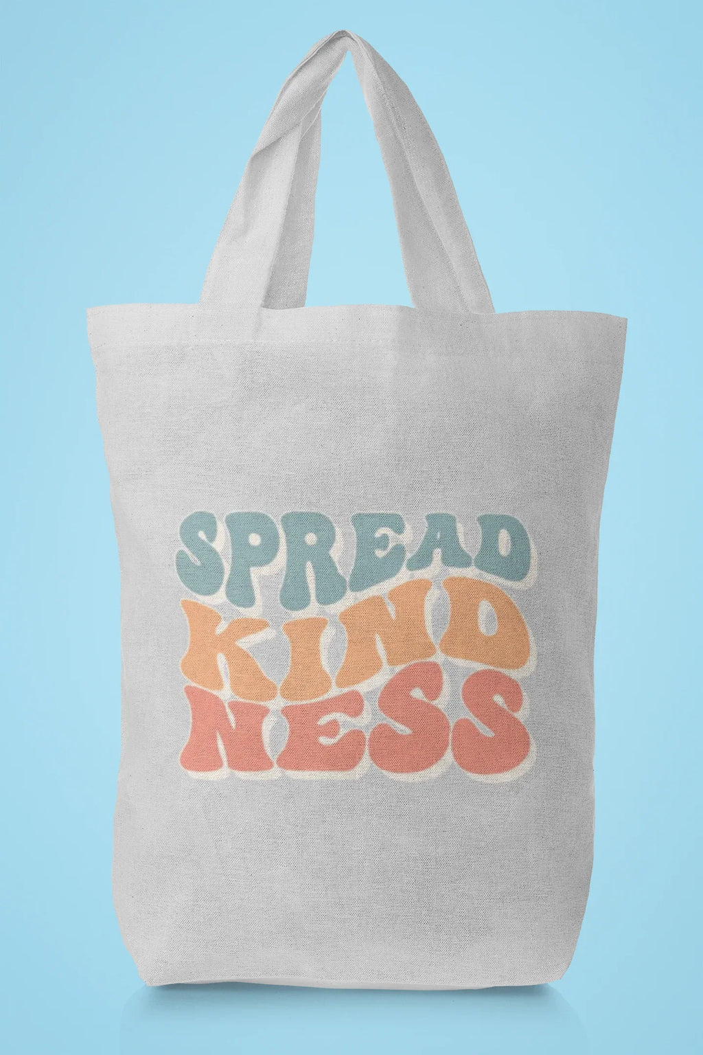 Light tan cotton tote bag with 'SPREAD KINDNESS' graphic on the front