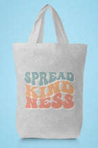 Light tan cotton tote bag with 'SPREAD KINDNESS' graphic on the front