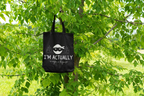 Black tote bag with ninja face logo and 'I'M ACTUALLY' text, 'a ninja in disguise'.