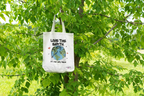 White tote bag with Earth graphic and text Love the Earth, it’s our only home