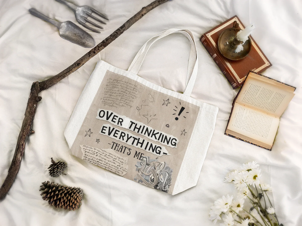 White canvas tote bag with printed quote and doodles, short handles