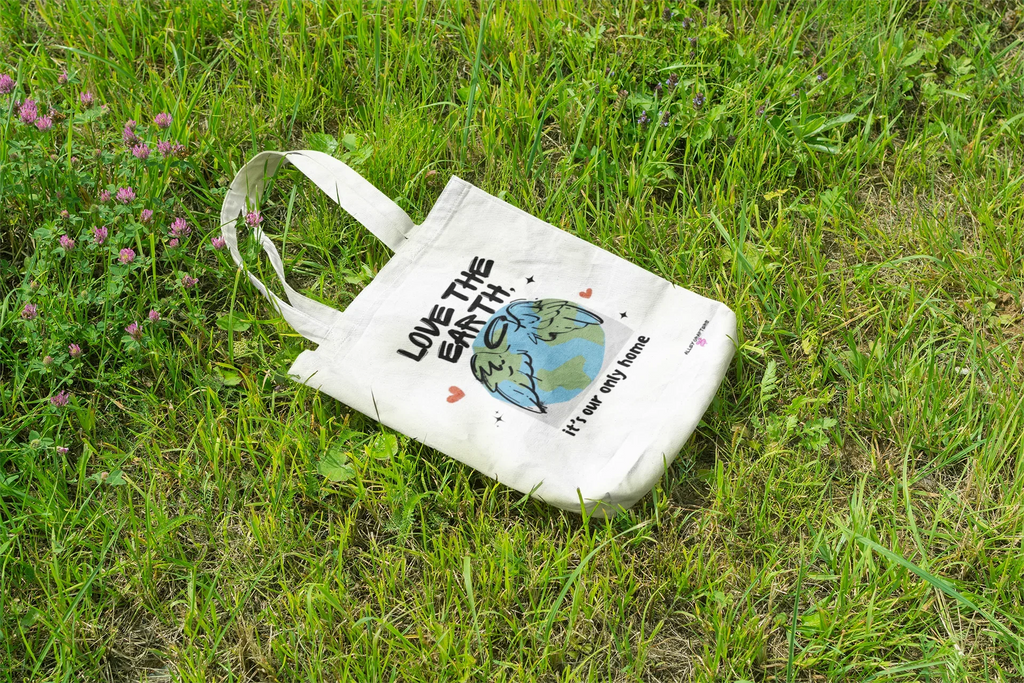White canvas tote bag with Earth graphic and text Love the Earth, it’s our only home