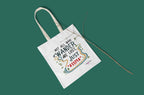 White canvas tote bag with colorful 'Not all who wander' design