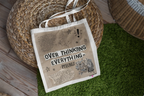 White tote bag on grass mat, 'OVER THINKING EVERYTHING - Pheonix' front print
