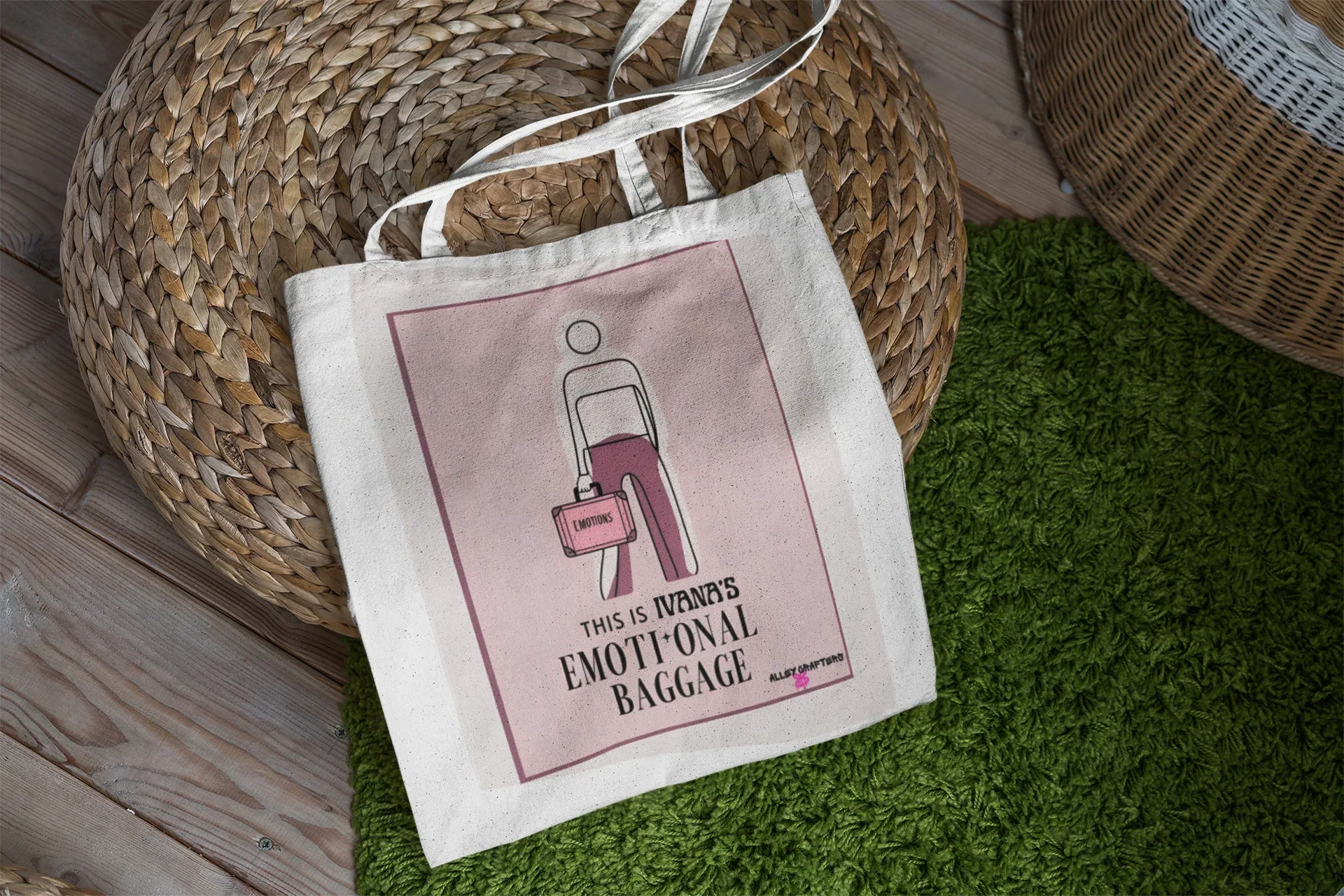 White canvas tote bag with pink square graphic and handle straps.