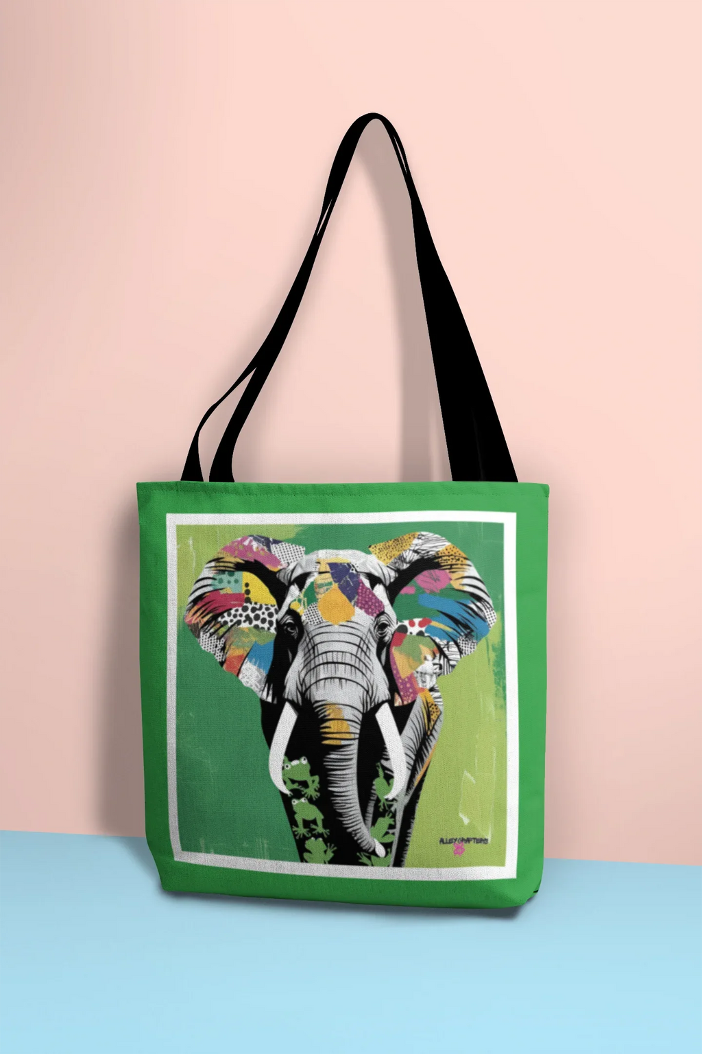 Green tote bag with colorful elephant pop art graphic and black top handles