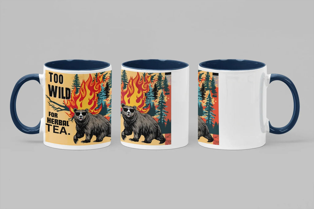 Set of three ceramic mugs with bear and flames graphic; blue handles and rims; “TOO WILD FOR HERBAL TEA.”