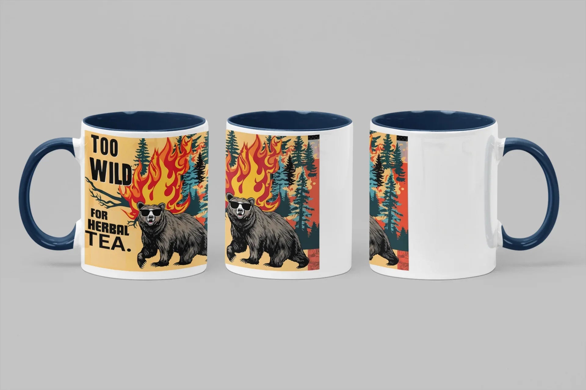 Set of three ceramic mugs with bear and flames graphic; blue handles and rims; “TOO WILD FOR HERBAL TEA.”
