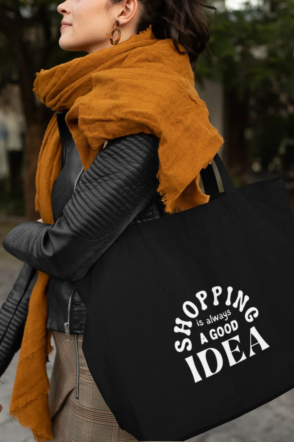 Black tote bag with white "SHOPPING" and pink "IDEA" text