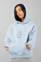 Light blue hooded sweatshirt with front couple graphic and kangaroo pocket