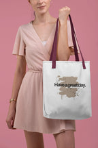 White canvas tote bag with short handles, “Have a great day.” splash graphic