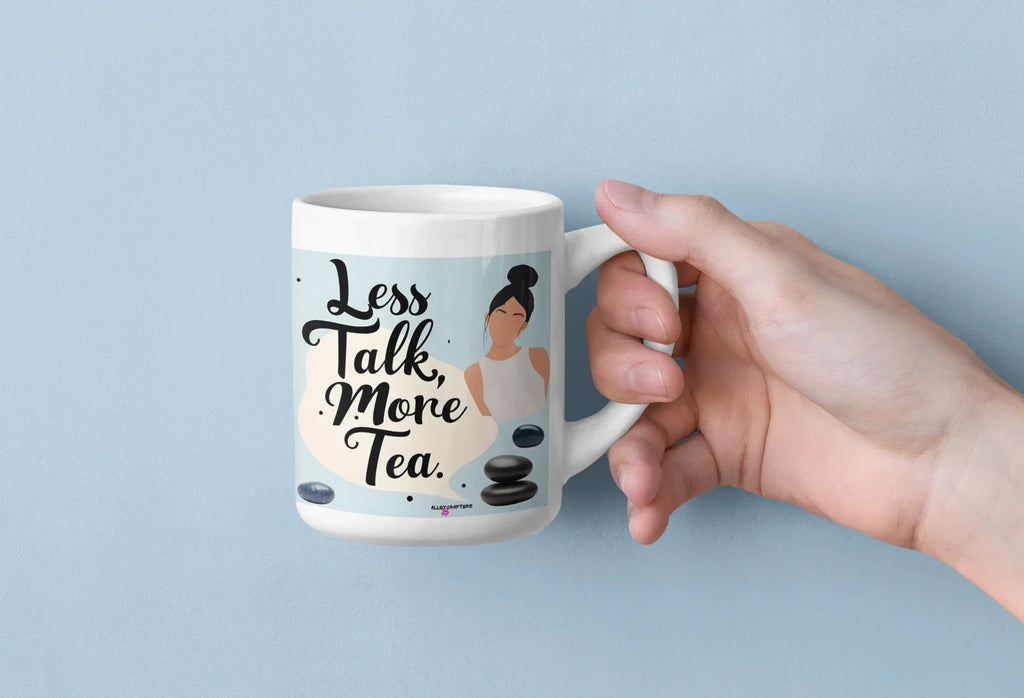 White ceramic tea mug with 'Less Talk, More Tea' text and tea-stone graphic