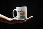 White ceramic mug with Millie name and floral pot graphic, held in hands