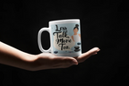 White tea mug with handle and 'Less Talk, More Tea' text on front