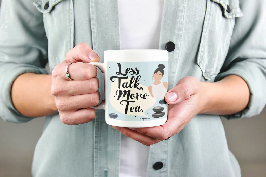 White ceramic tea mug with 'Less Talk, More Tea' quote and woman illustration