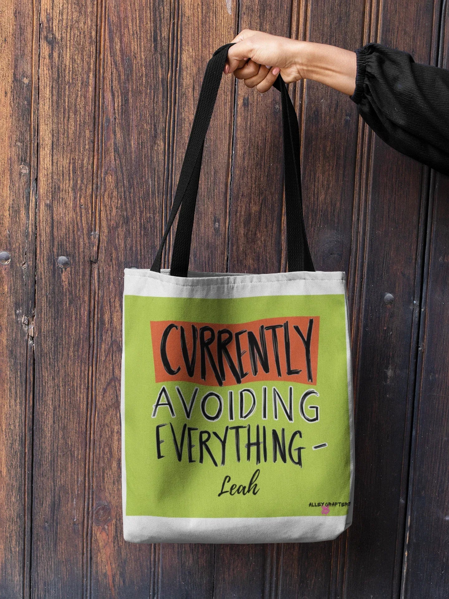 White canvas tote with lime green front panel and 'Currently Avoiding Everything-' text, Leah