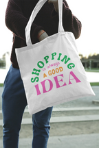 White tote bag with green "SHOPPING" and pink "IDEA" lettering