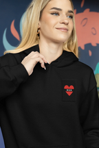 Black unisex hoodie with small heart embroidery patch on chest