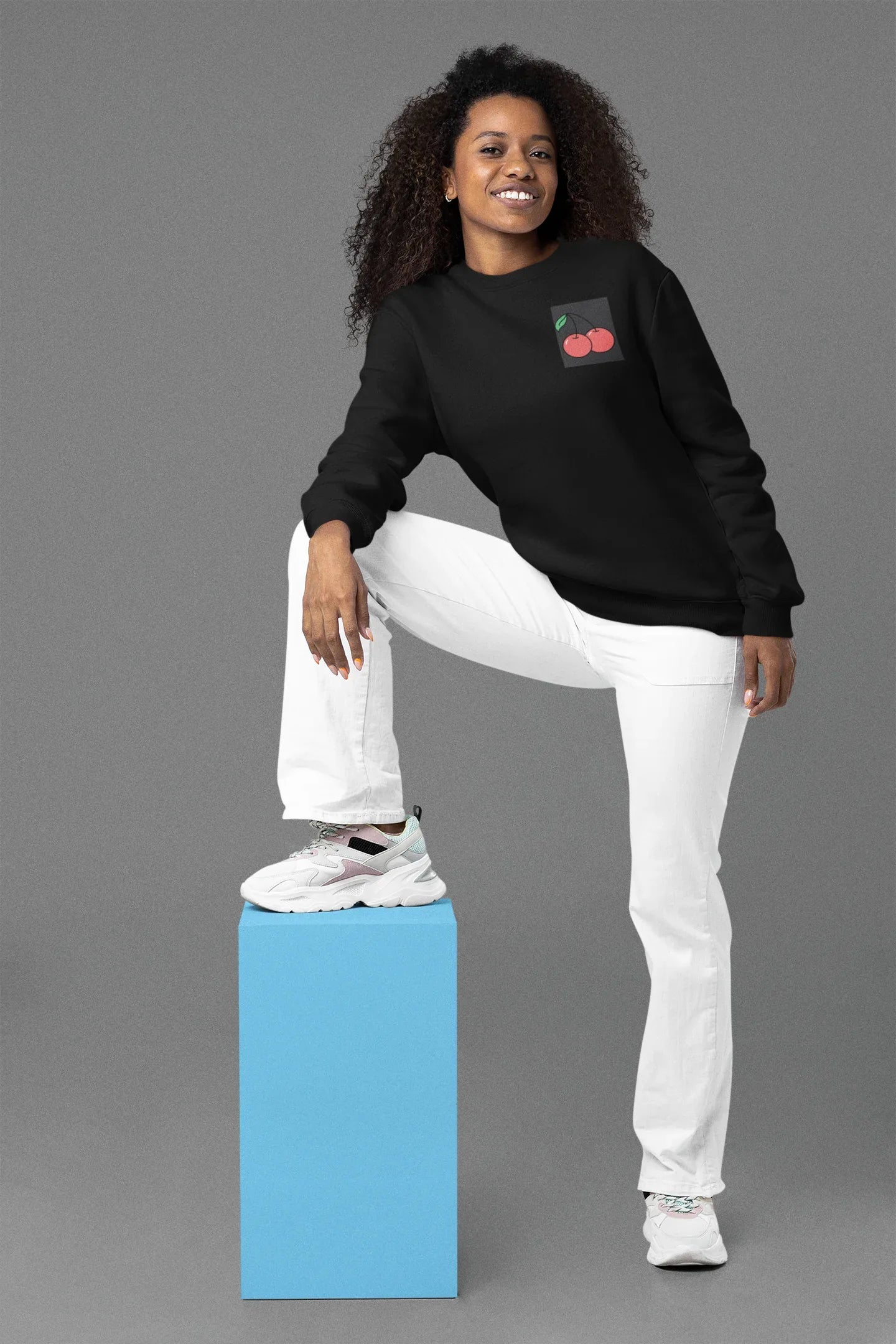 Black crewneck sweatshirt with cherry embroidery patch on the left chest