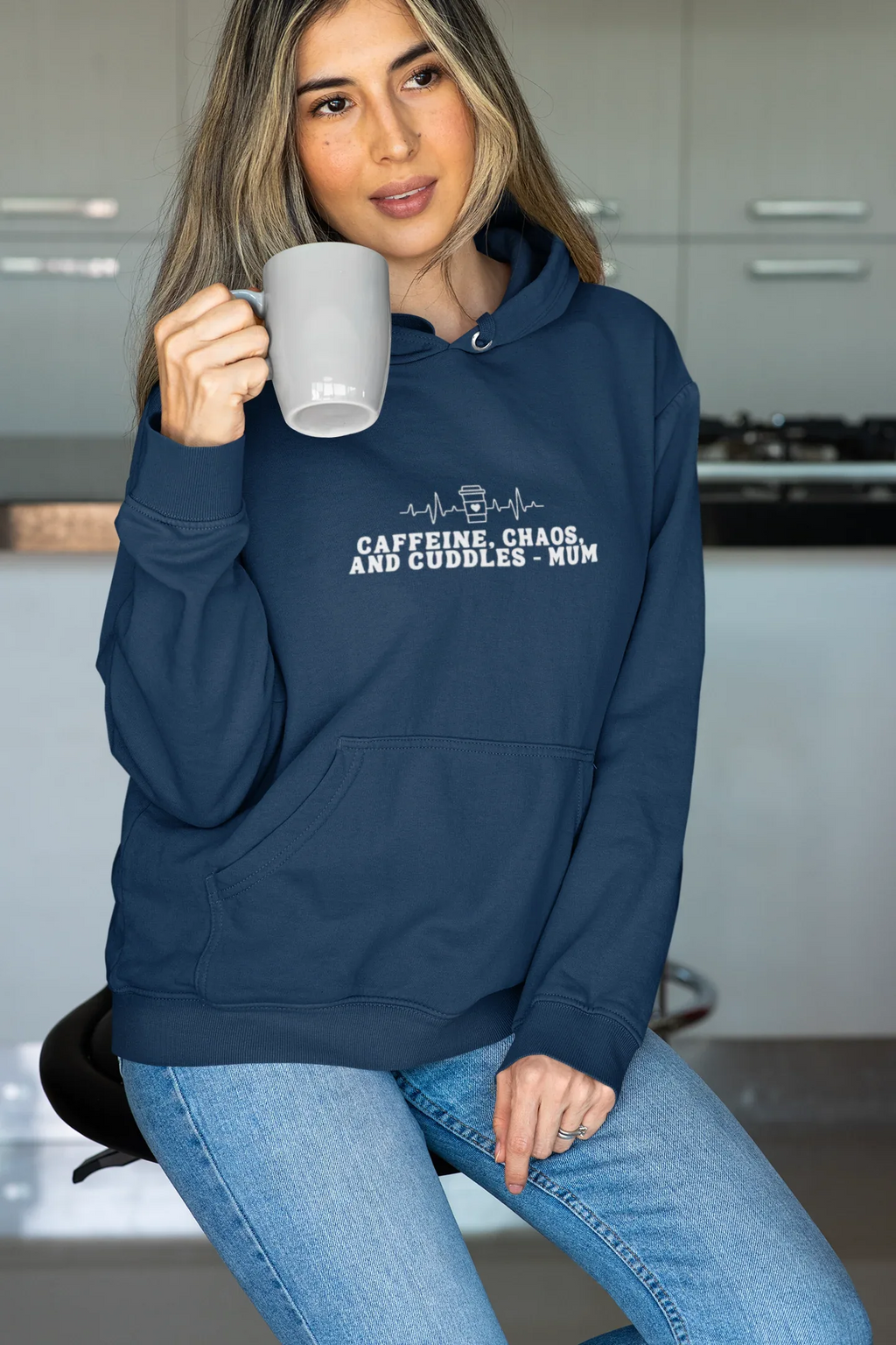 Navy hoodie sweatshirt with kangaroo pocket and 'Caffeine, Chaos, and Cuddles' chest graphic