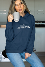 Navy hoodie sweatshirt with kangaroo pocket and 'Caffeine, Chaos, and Cuddles' chest graphic
