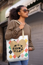 White canvas tote bag with heart logo and multicolor diamond pattern, long handles