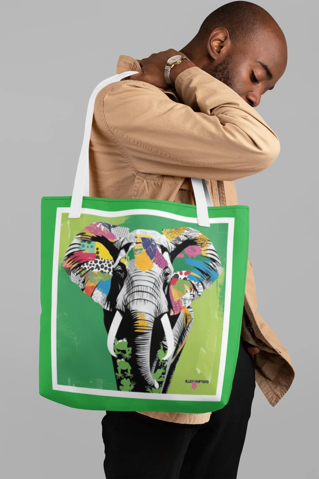 Green tote bag with multicolor elephant pop art graphic and white-bordered frame