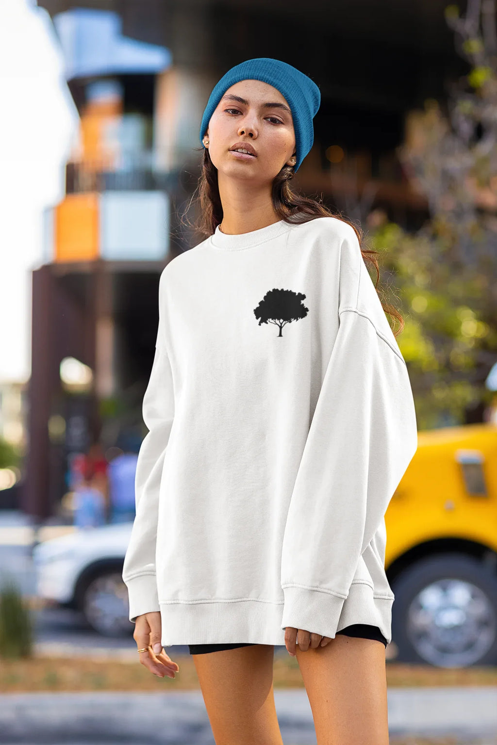 White sweatshirt with small tree logo on the chest