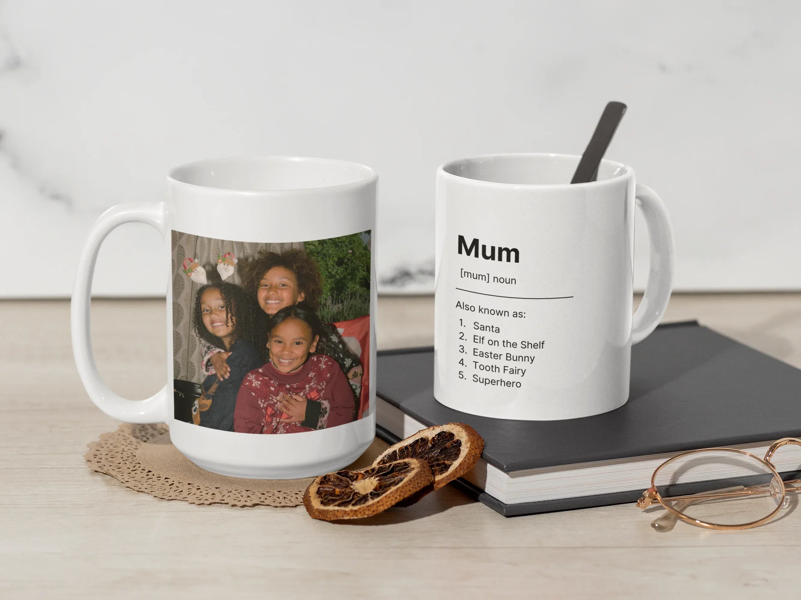 Two white ceramic mugs, one with custom family photo and one with “Mum” text