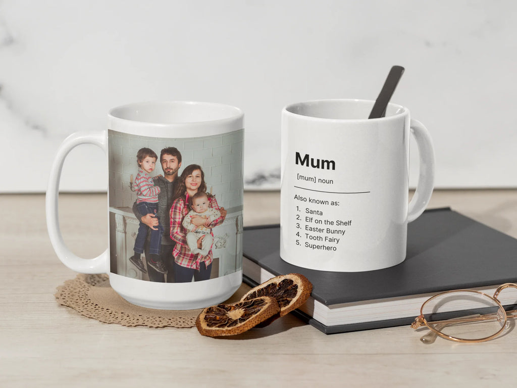 Two white ceramic mugs on a surface; one shows “Mum” text and saying list