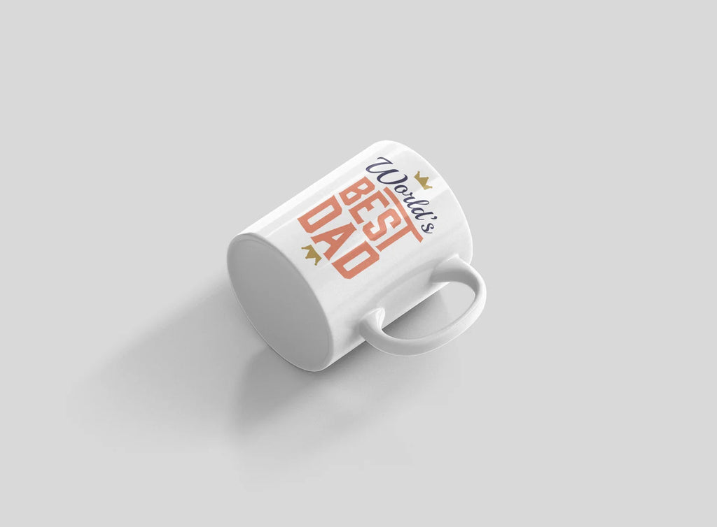White mug with World's Best Dad crown and red stacked letters, angled view.