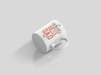 White mug with World's Best Dad crown and red stacked letters, angled view.