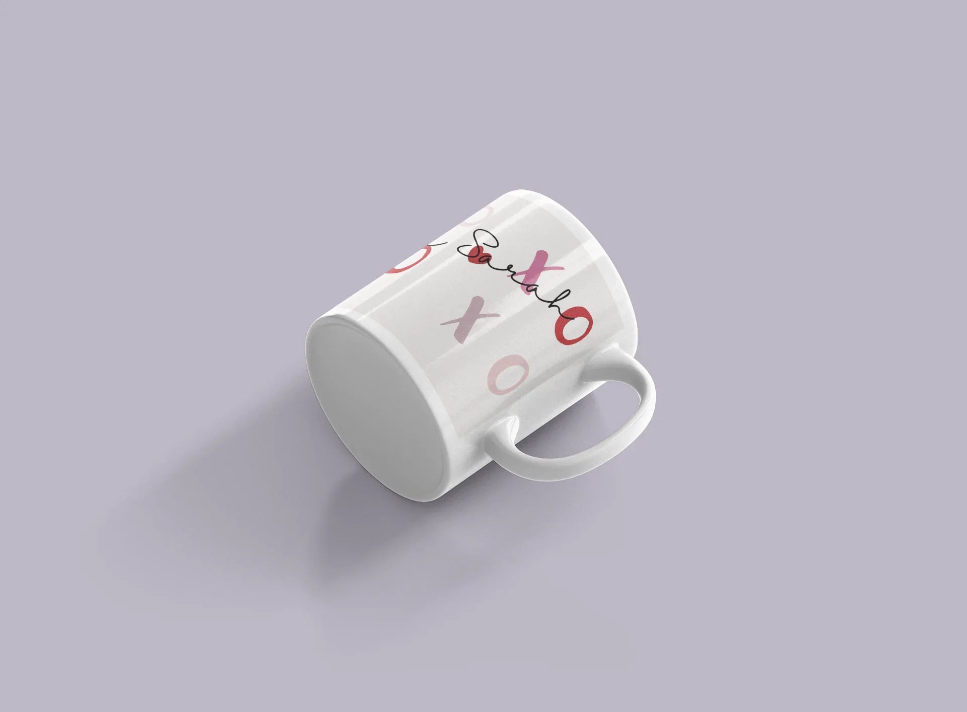 White ceramic mug angled view with red XO and “Love” text on the side