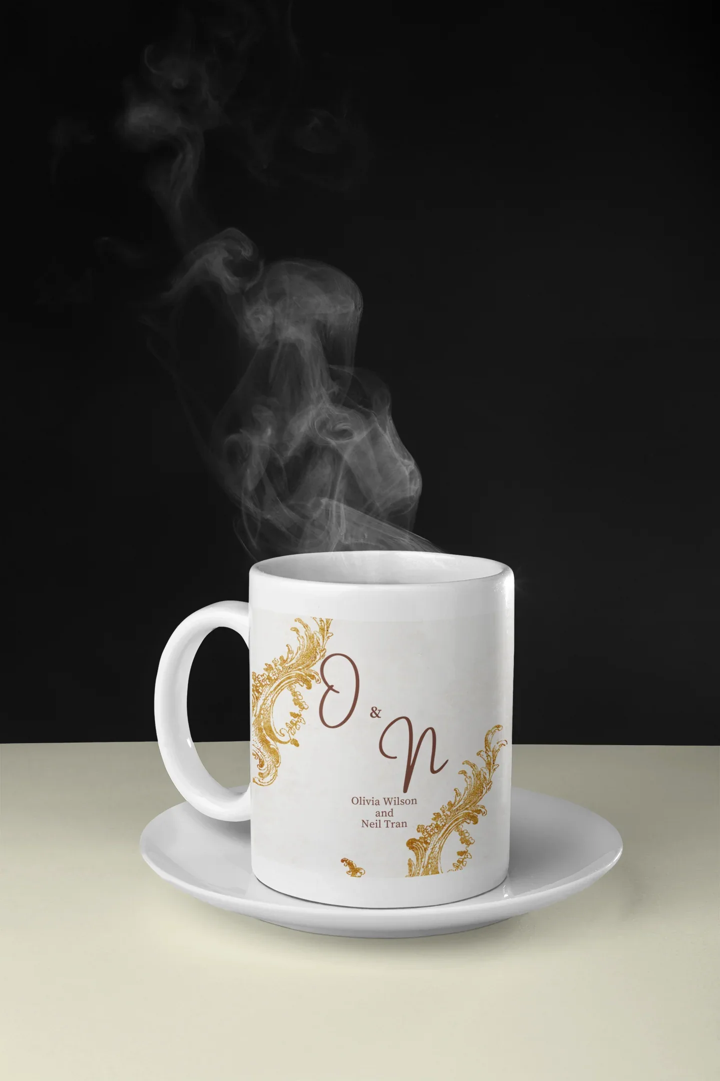 White wedding mug with gold filigree and dark red 'O & N' printed, steaming
