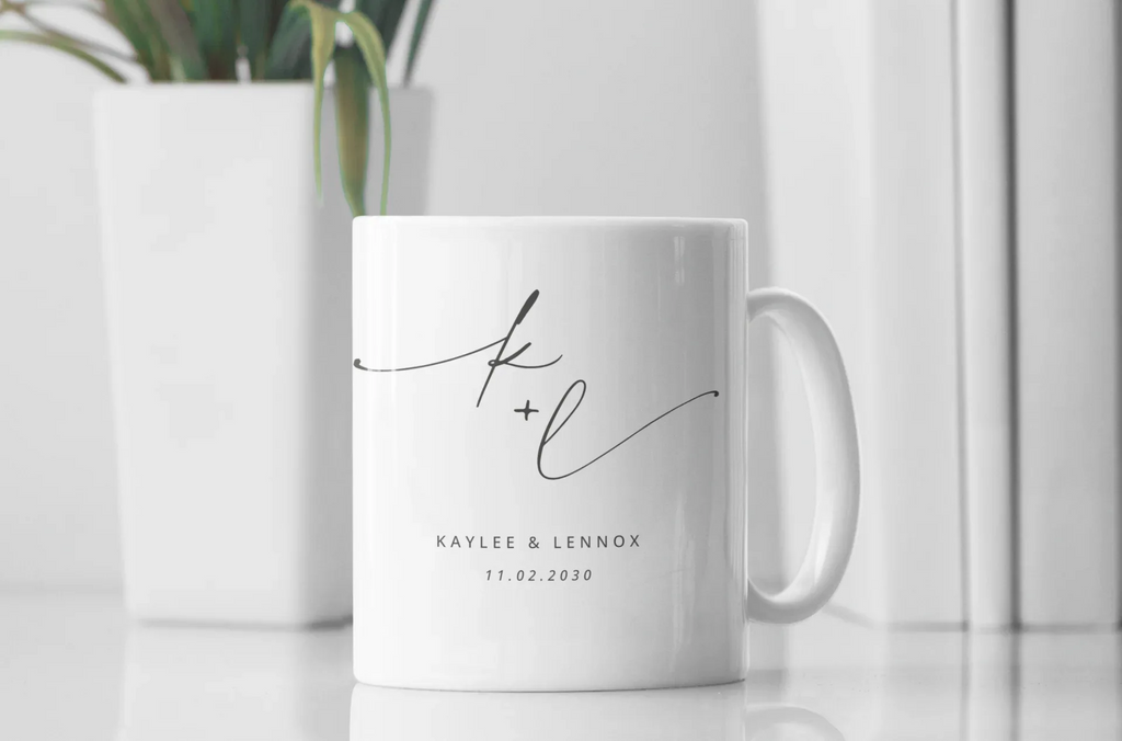 White ceramic mug with monogram k + l and date 11.02.2030, printed on front.