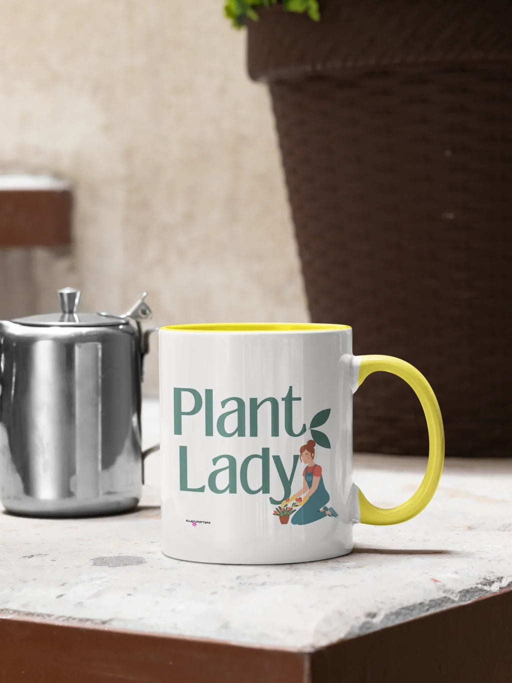 White coffee mug with yellow rim and handle, “Plant Lady” botanical design